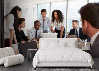 Group Of Businesspeople Meeting Around Table In Office Wall mural