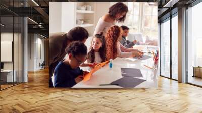 Group Of Children At Home With Parents Having Fun Making Craft Together Wall mural