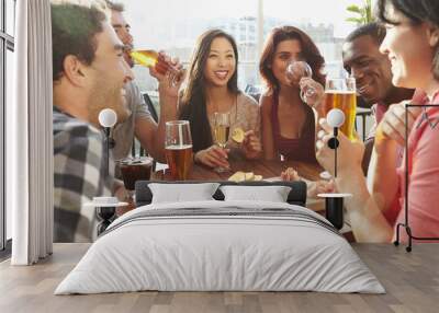 group of friends enjoying drink and snack in rooftop bar Wall mural