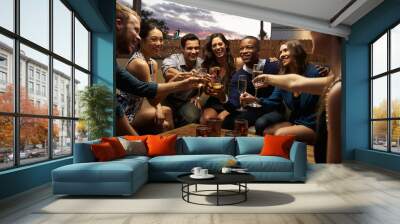 Group Of Friends Enjoying Night Out At Rooftop Bar Wall mural