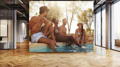 Group Of Friends On Vacation Relaxing Next To Outdoor Pool Wall mural