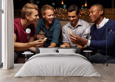 Group Of Male Friends Enjoying Night Out At Rooftop Bar Wall mural