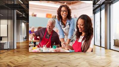 Group Of Mature Adults Attending Art Class In Community Centre With Teacher Wall mural