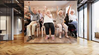 Group Of Seniors Enjoying Fitness Class In Retirement Home Wall mural