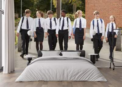 Group Of Teenage Students In Uniform Outside School Buildings Wall mural