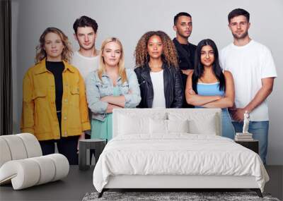 Group Studio Shot Of Young Multi-Cultural Friends Smiling And Laughing At Camera Wall mural