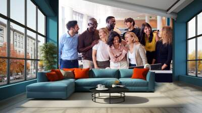 Happy Business Team Working In Modern Office Laughing Together Wall mural