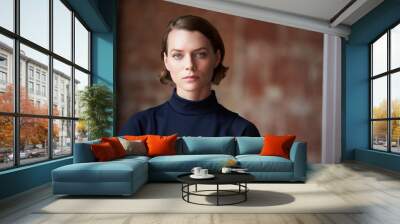 head and shoulders portrait of young businesswoman in office Wall mural