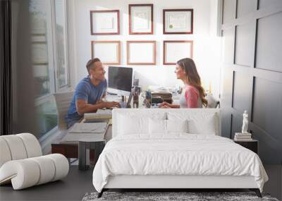 Hispanic Couple Working On Laptops In Home Office Together Wall mural