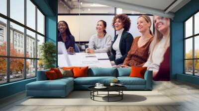 Line Of Businesswomen In Modern Office Listening To Presentation By Colleague Wall mural