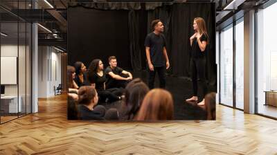 Male And Female Drama Students At Performing Arts School In Studio Improvisation Class Wall mural