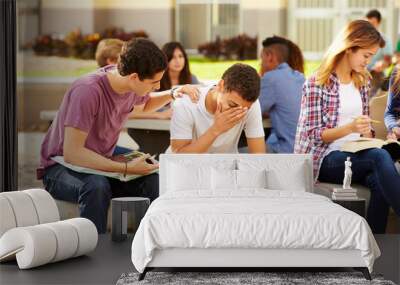 Male High School Student Comforting Unhappy Friend Wall mural