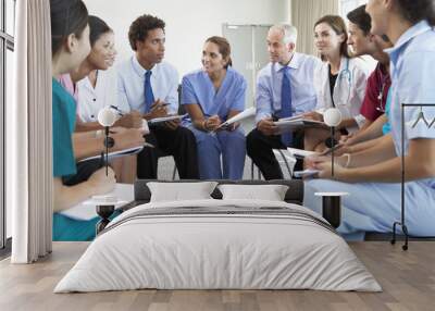 Medical Staff Seated In Circle At Case Meeting Wall mural