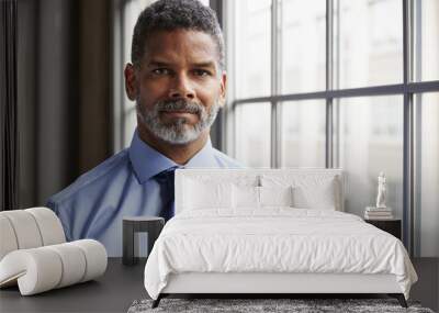 Middle aged black businessman looking to camera Wall mural