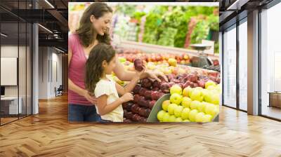 mother and daughter shopping for fresh produce Wall mural