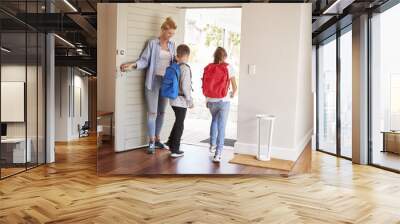 Mother Getting Children Ready To Leave House For School Wall mural