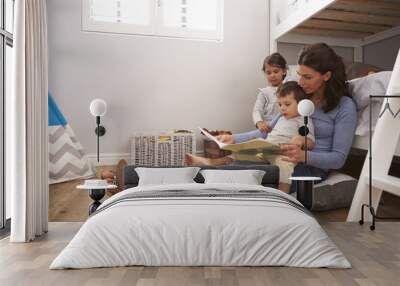 Mother Reading Story To Children In Their Bedroom Wall mural