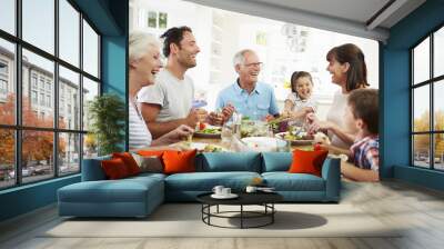 multi generation family eating meal around kitchen table Wall mural