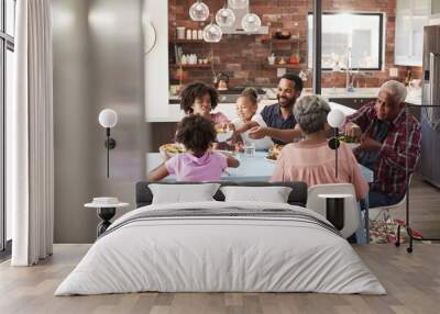 Multi Generation Family Enjoying Meal Around Table At Home Wall mural