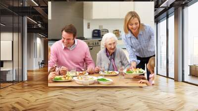 multi-generation family sharing meal together Wall mural