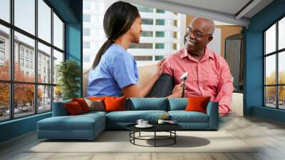 nurse visiting senior male patient at home Wall mural