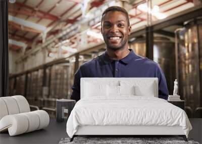 Portrait of a young black man working at a wine factory Wall mural