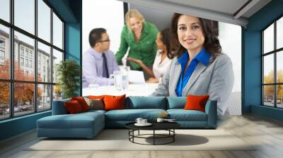 Portrait Of Businesswoman In Boardroom With Colleagues Wall mural