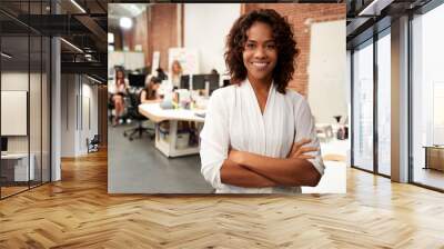 Portrait Of Businesswoman In Modern Open Plan Office With Business Team Working In Background Wall mural