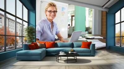 Portrait Of Businesswoman Working In Creative Office Wall mural