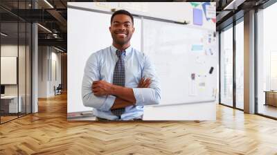 Portrait of confident African American male teacher in class Wall mural