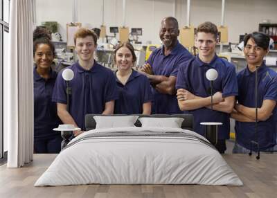 Portrait Of Engineer And Apprentices In Factory Wall mural