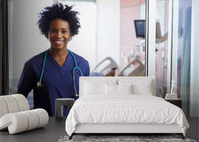 Portrait Of Female Nurse With Patient In Background Wall mural