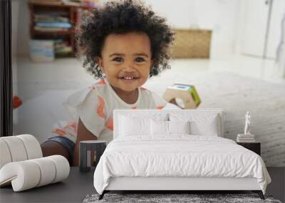 Portrait Of Happy Baby Girl Playing With Toys In Playroom Wall mural