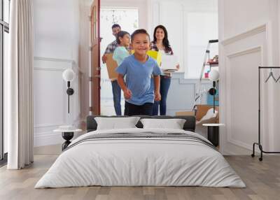 Portrait Of Hispanic Family Moving Into New Home Wall mural