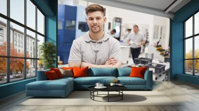 portrait of male engineer on factory floor of busy workshop Wall mural