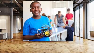 Portrait Of Male Student Building Robot Vehicle In After School Computer Coding Class Wall mural