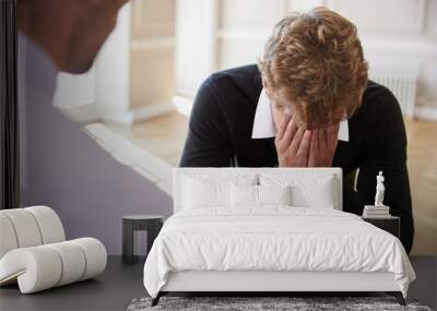 School Counselor Talking To Depressed Male Pupil Wall mural