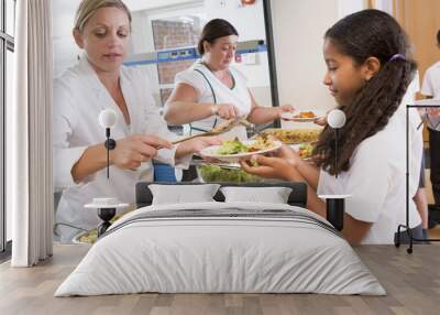 schoolgirl holding plate of lunch in school cafeteria Wall mural