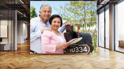 senior hispanic couple checking mailbox Wall mural