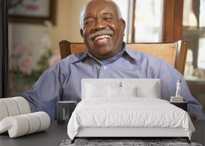 senior man relaxing in armchair Wall mural