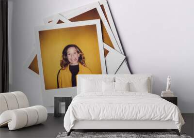 Stack Of Instant Film Photos From Modeling Casting In Studio With Shot Of Young Woman On Top Wall mural