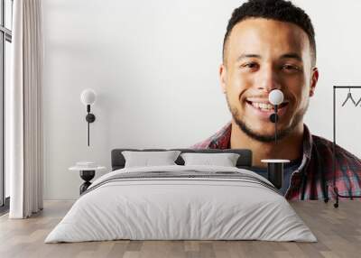 Studio Portrait Of Smiling Man Against White Background Wall mural