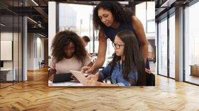 Teacher helping high school students with technology Wall mural