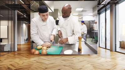 Teacher Helping Students Training To Work In Catering Wall mural