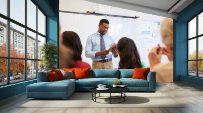 teacher using tablet computer at an adult education class Wall mural