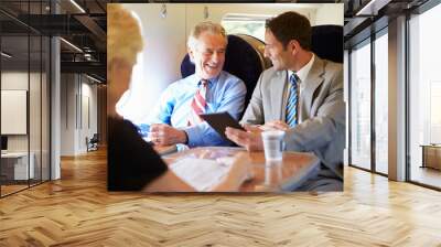 two businessmen having meeting on train Wall mural