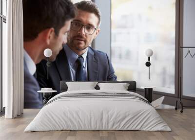 two businessmen using digital tablet in office meeting Wall mural