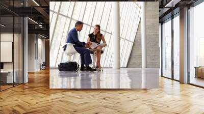 two businesswomen meeting in reception of modern office Wall mural