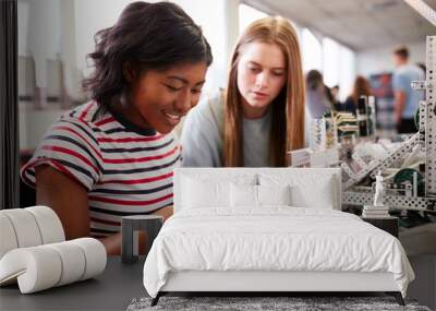 Two Female College Students Building Machine In Science Robotics Or Engineering Class Wall mural