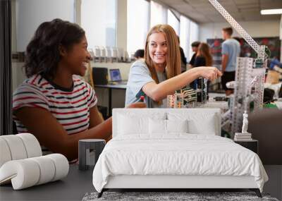 Two Female College Students Building Machine In Science Robotics Or Engineering Class Wall mural